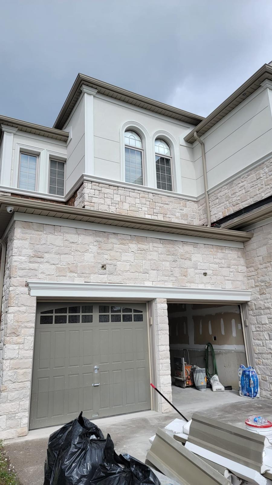 Stone facade with arched paired windows