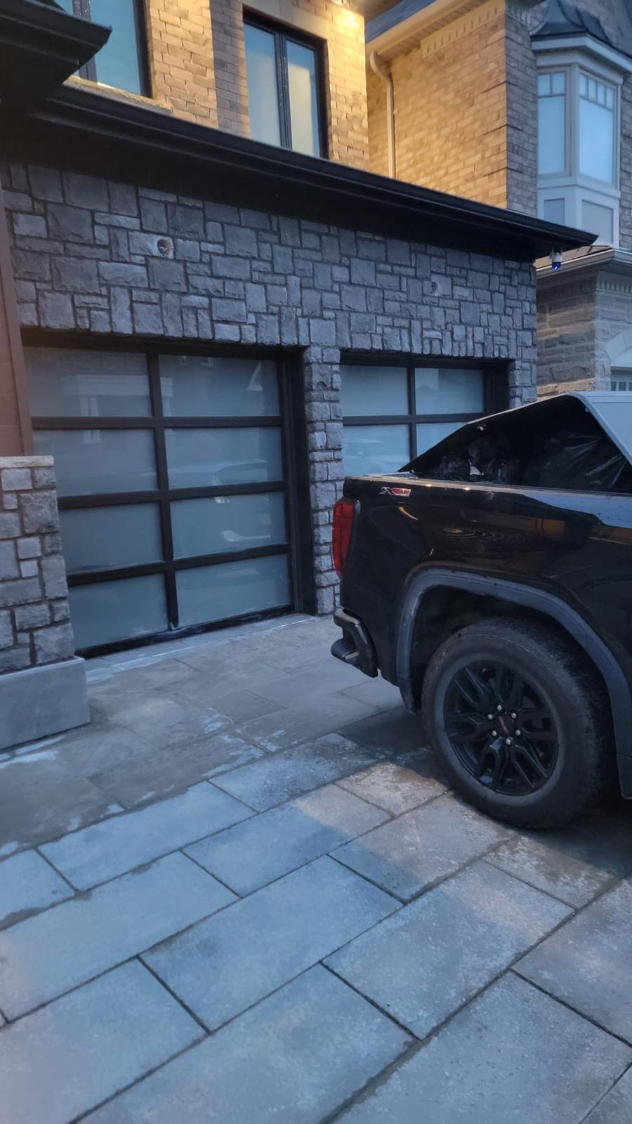 Stone garage exterior at dusk, close angle