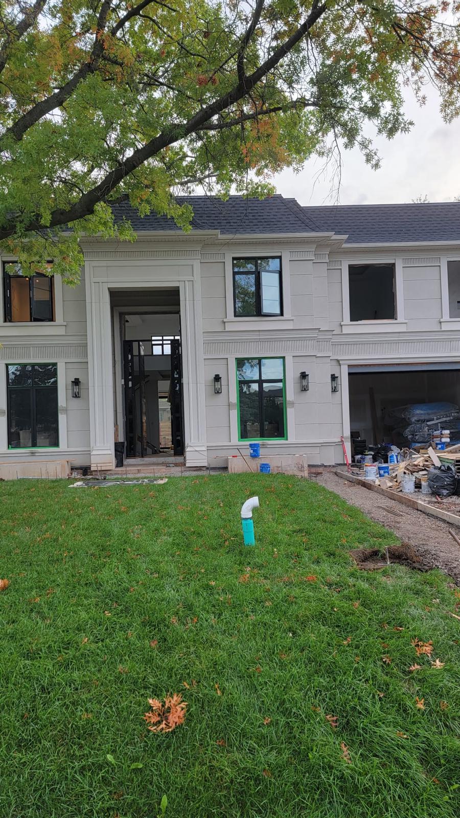 Grand white stucco estate front entrance