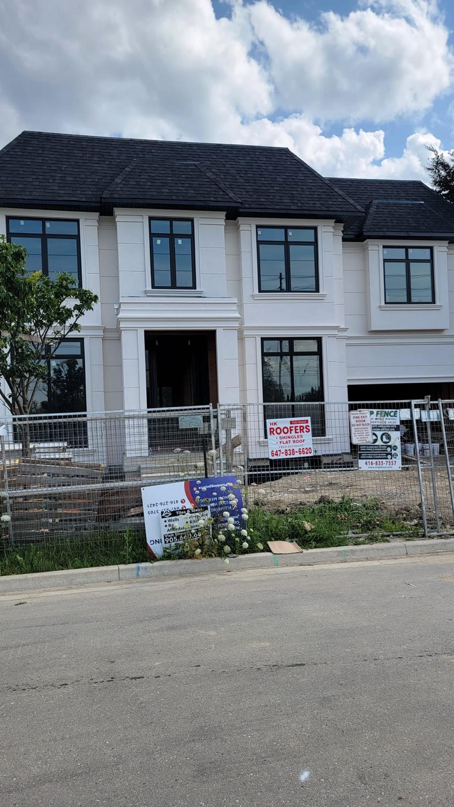 Grand stucco estate street-facing elevation