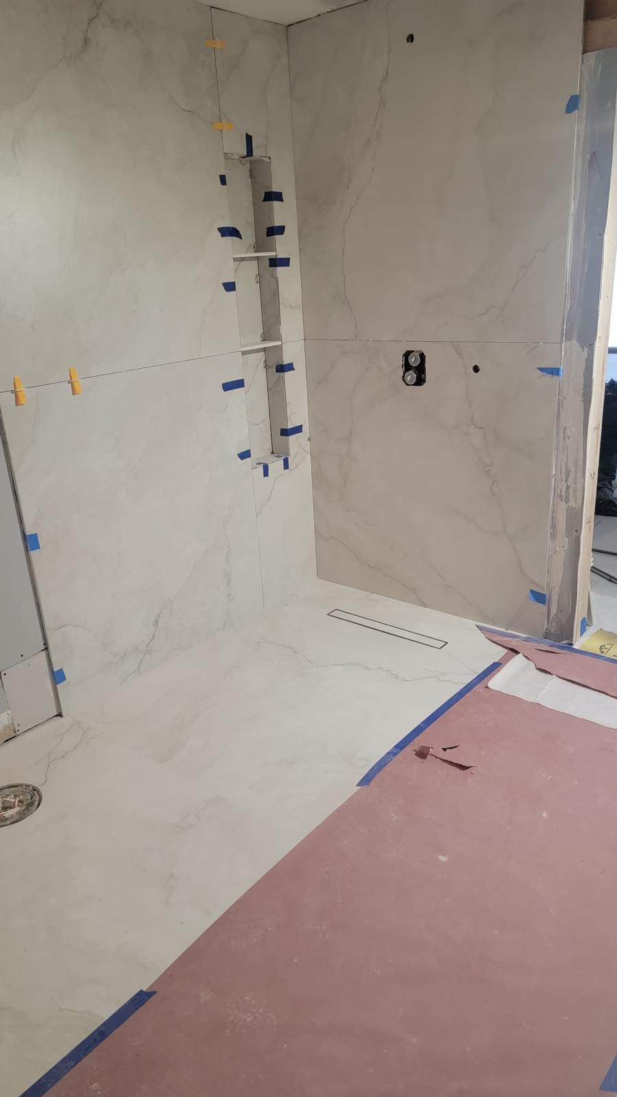 Marble shower wall with built-in niche