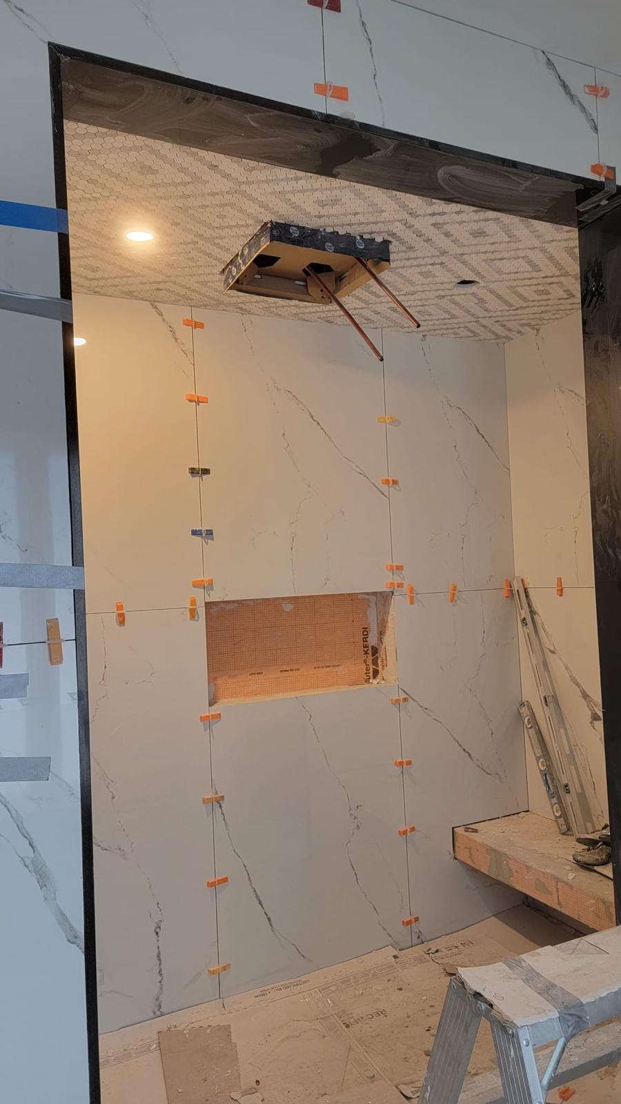 Marble ensuite with mosaic ceiling accent
