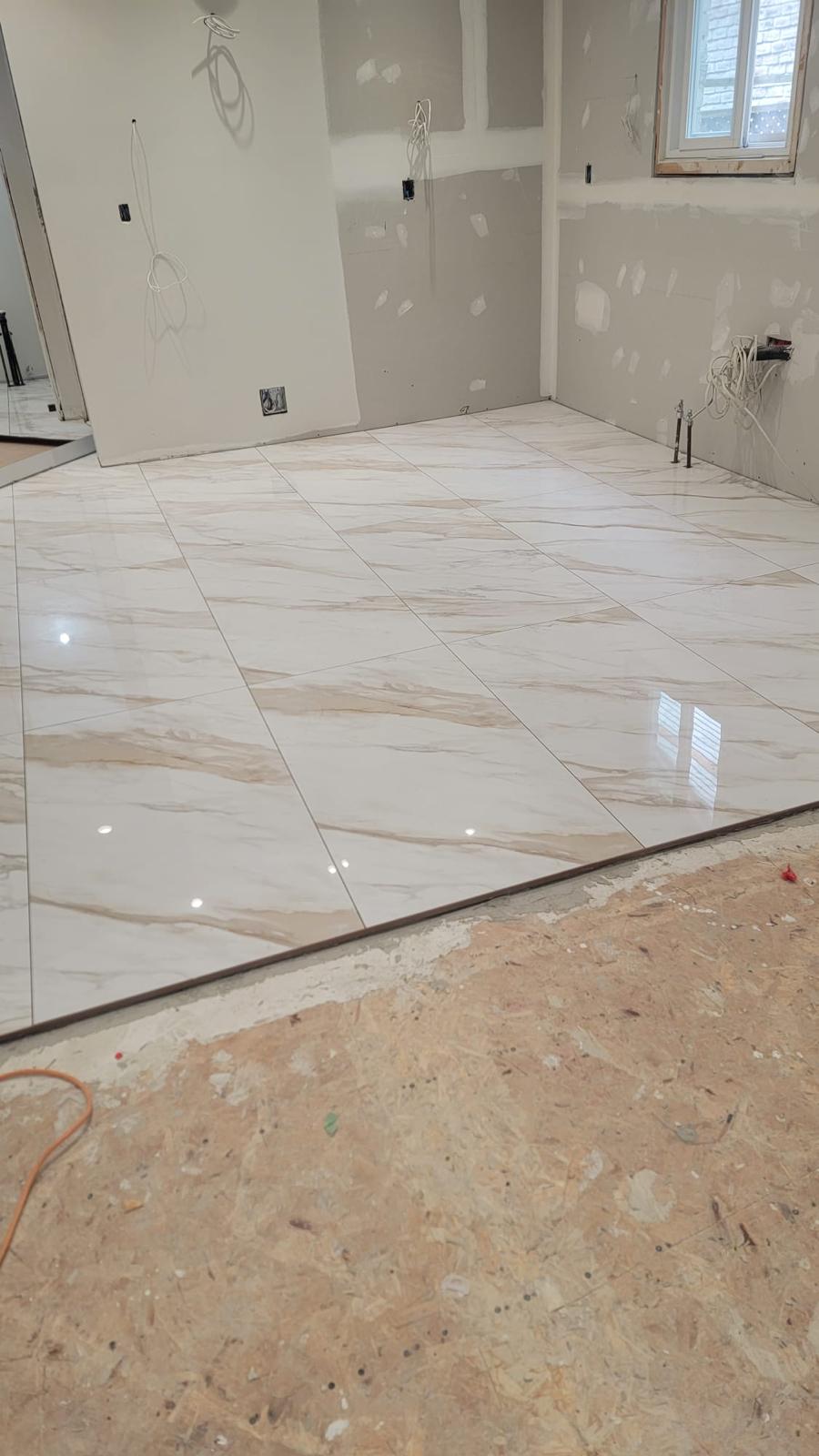 Warm marble floor tile, wider room view